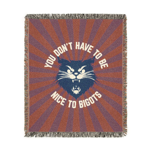 Woven blanket with a cat design and text on a white background