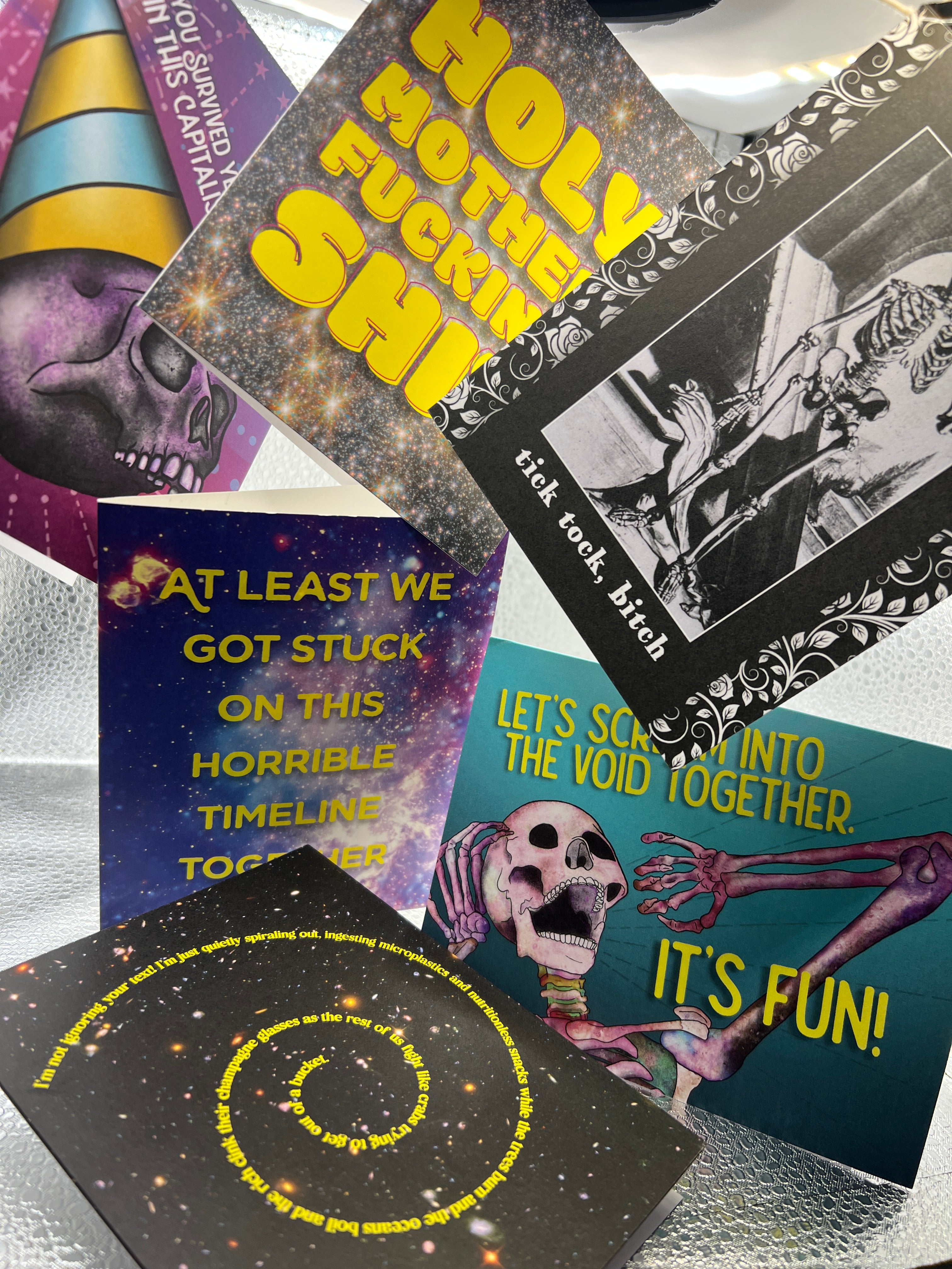 Collage of colorful cards with text and graphics on a textured surface