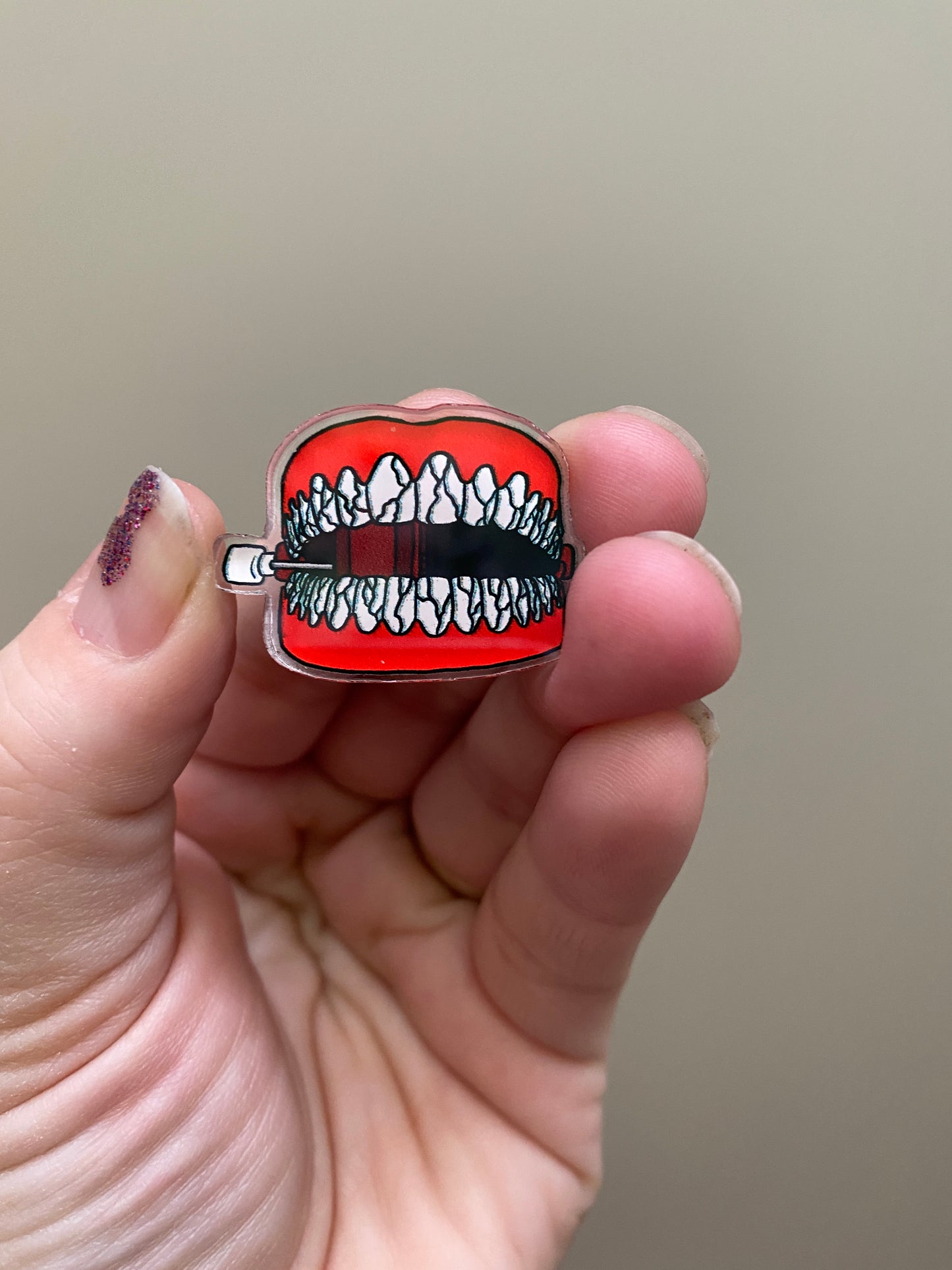 Broken Chattering Teeth acrylic pin