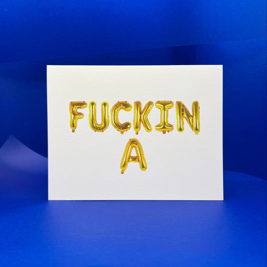 White card with gold text 'FUCKIN A' on a blue background