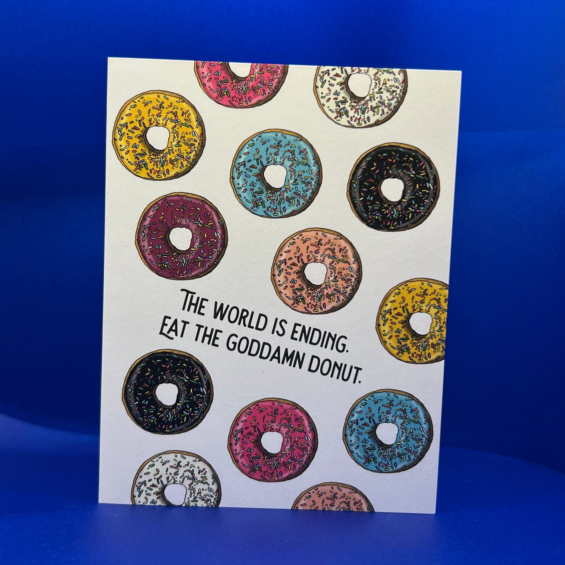 Sticker with colorful donut design and text on a blue background