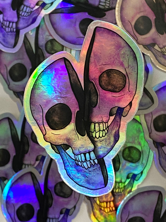 Holographic skull sticker with colorful design on a background of other similar stickers.